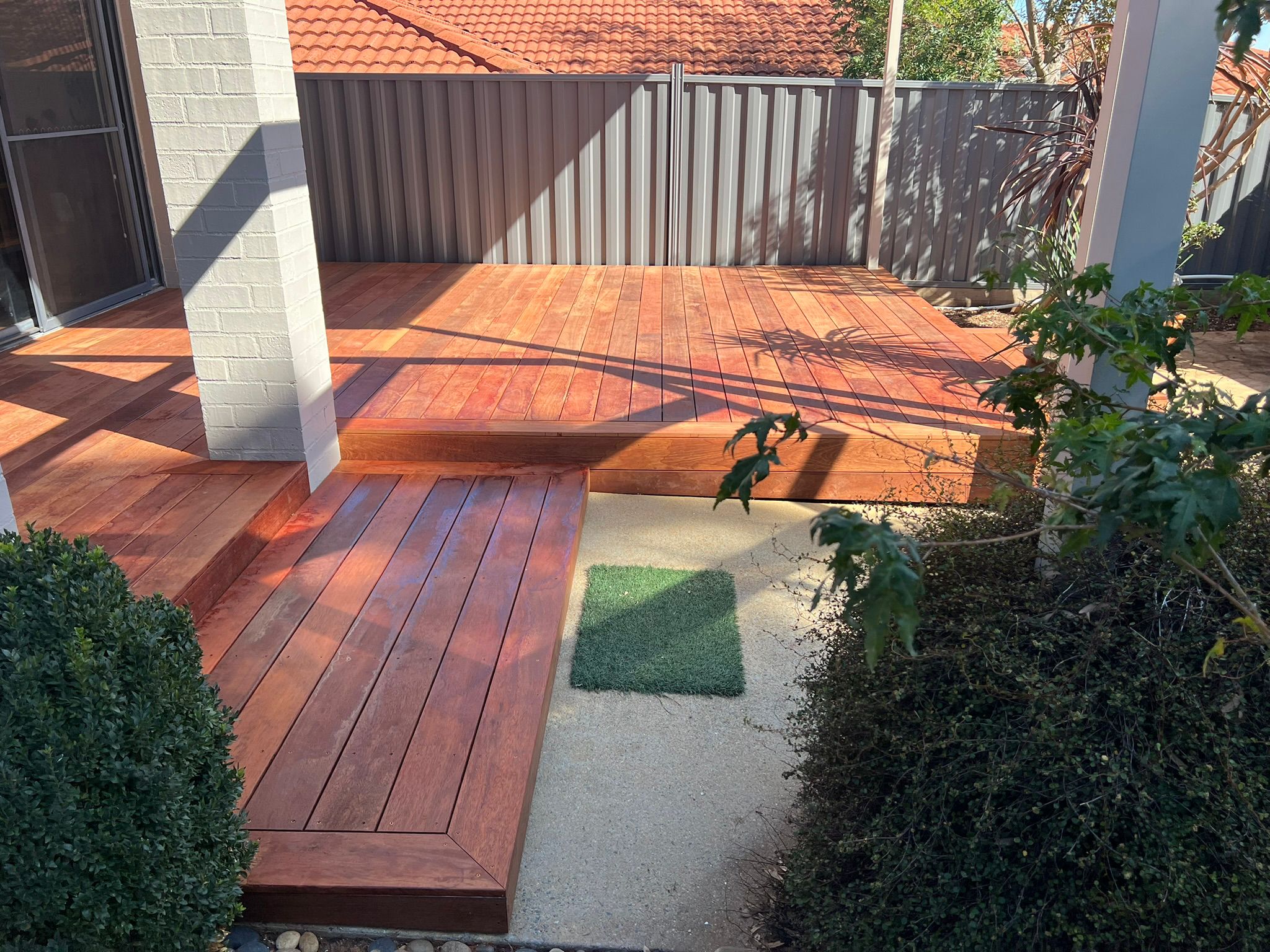 Side elevation of multi-structure build with Merbau decking, Bruce Canberra