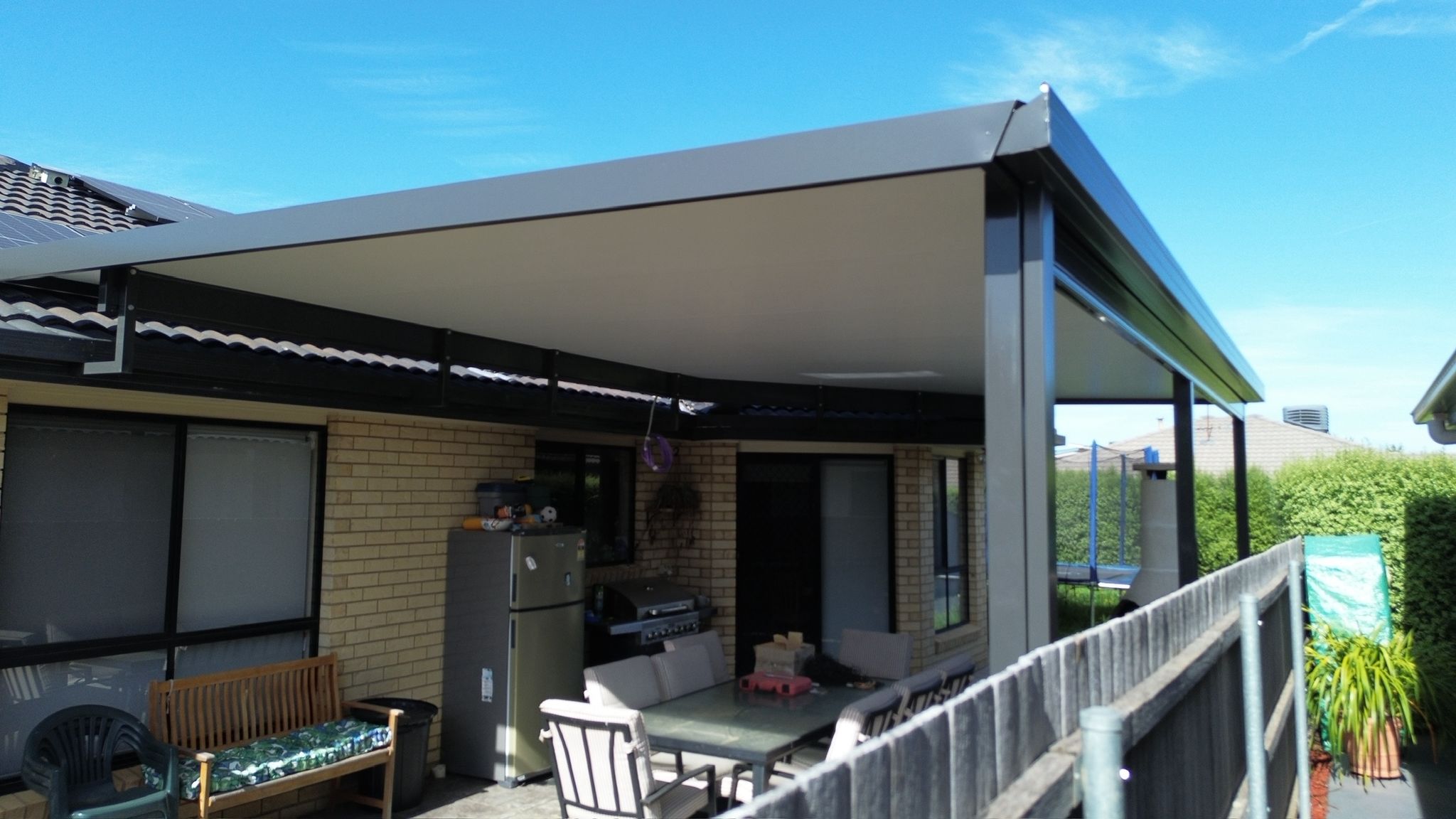 Flyover pergola with insulated roof panel extending from home, Dunlop Canberra