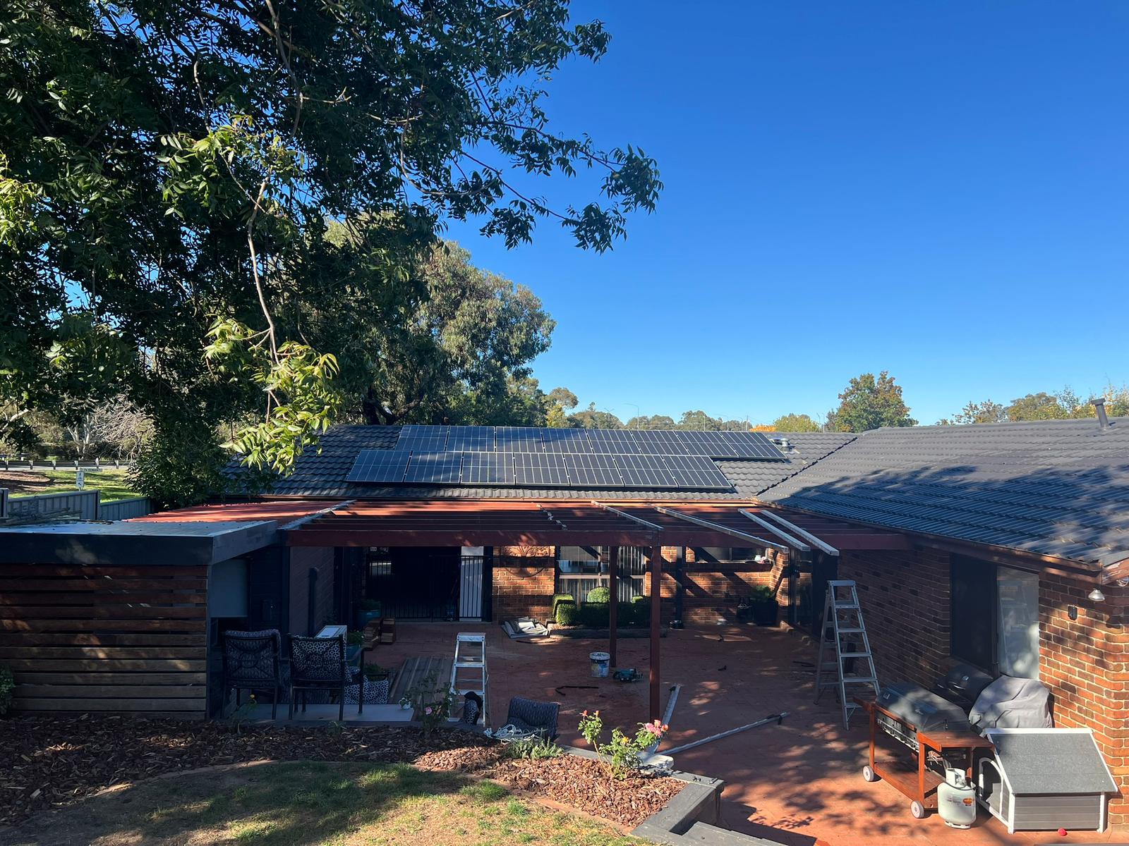 Fascia-fixed pergola with insulated roof panel and riser brackets, Florey Canberra
