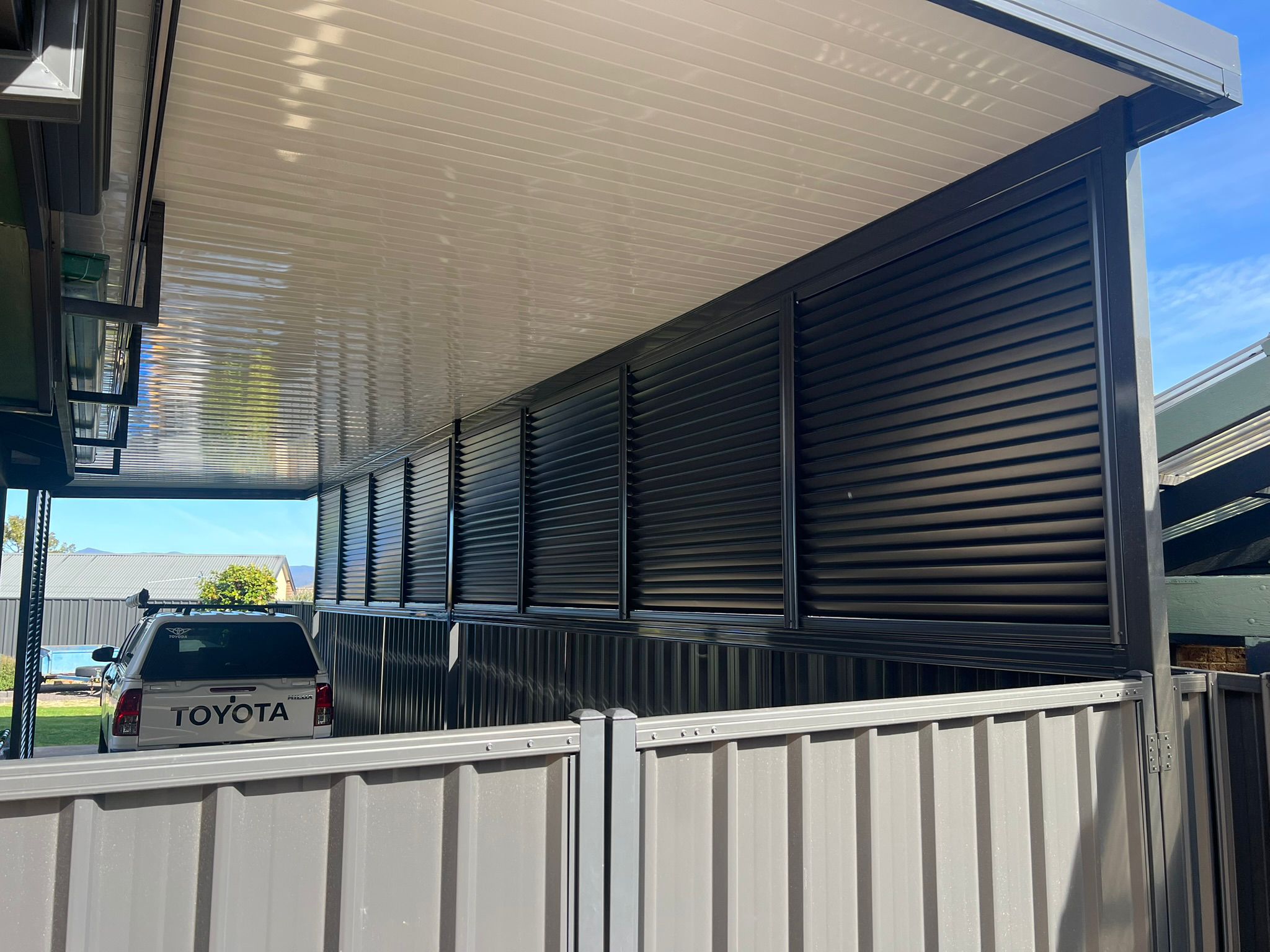 Carport with Flatdeck roof and Louvrescreen privacy panels, Gowrie Canberra