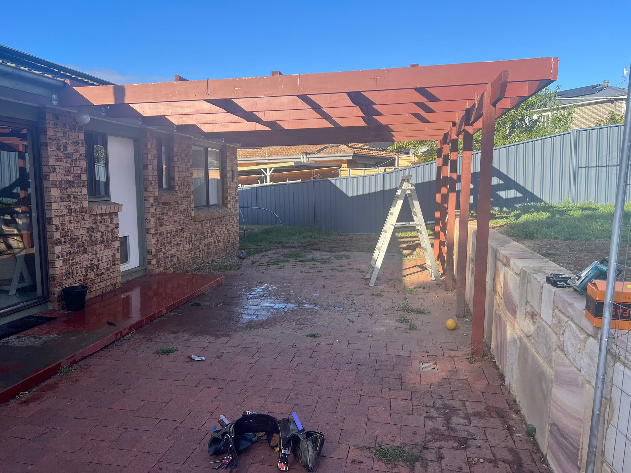 Flyover pergola with insulated roof panel extending from home, Gowrie Canberra